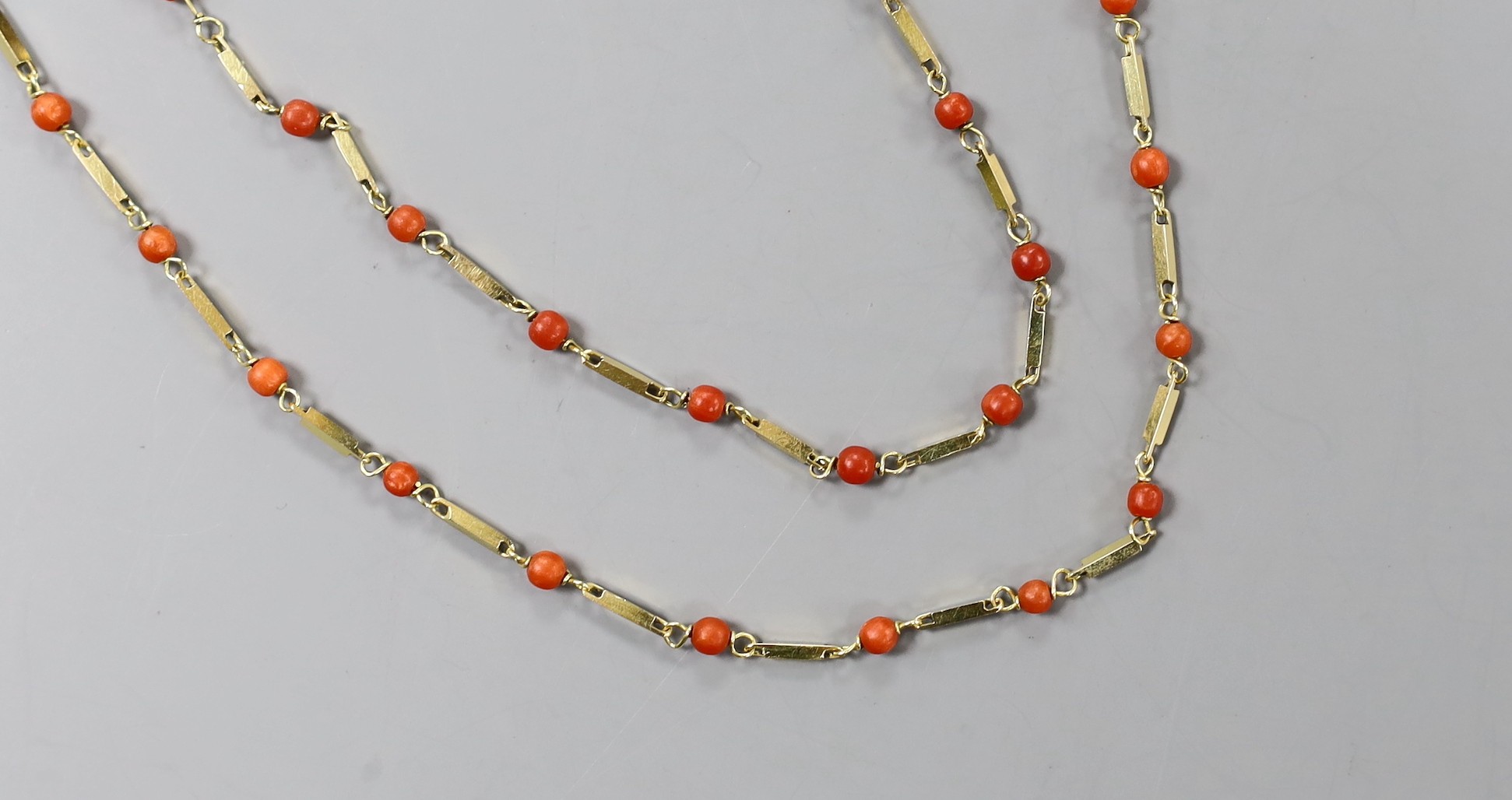 A modern Italian 750 yellow metal and coral bead necklace, 39cm and matching bracelet, 17.75cm, gross weight 9.3 grams.
